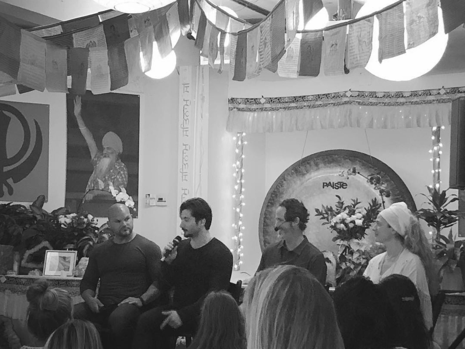On a panel, under the prayer flags.